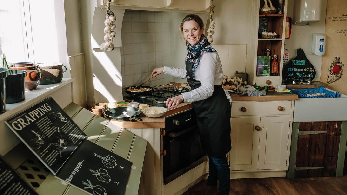 Natasha Boswell, cooking some garlic mushrooms in the farm kitchen